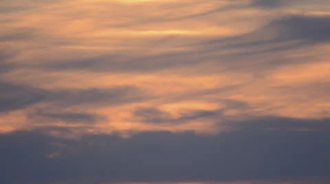 Lovely slow moving pink clouds at dusk time lapse 4K version Stock Footage 24802347