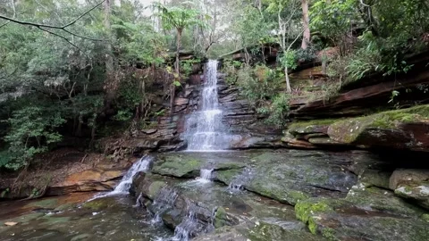 Lovely small waterfall Stock Footage 207437986