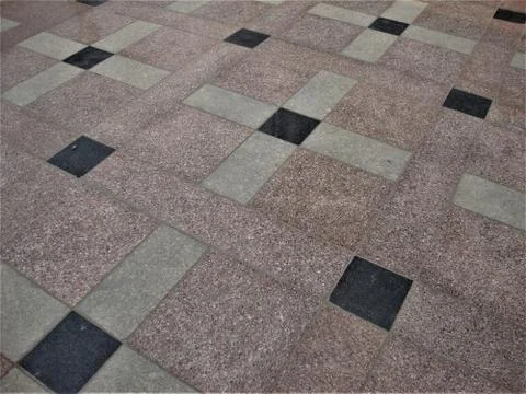 Lovely stone chips floor pattern in white, red, black squares and rectangle Stock Photos