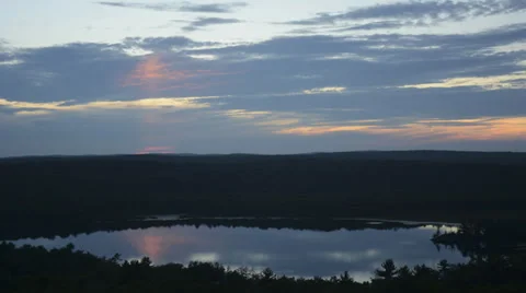 Lovely sunset over lake, forest with cloud reflections time lapse wide HD1080 Stock Footage 39720587