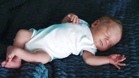 Lovely tiny baby boy in white bodysuit. Stock Footage 250133161