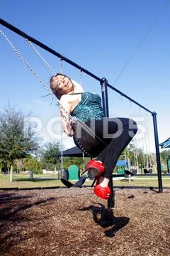 Lovely, voluptuous brunette on a swing (8) Stock Photos