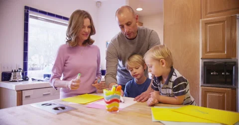 Lovely white family drawing together in the kitchen Stock Footage