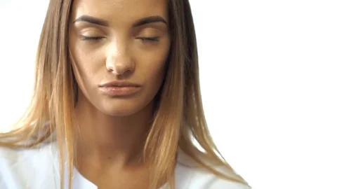 Lovely young blonde with brown eyes check her vision Stock Footage