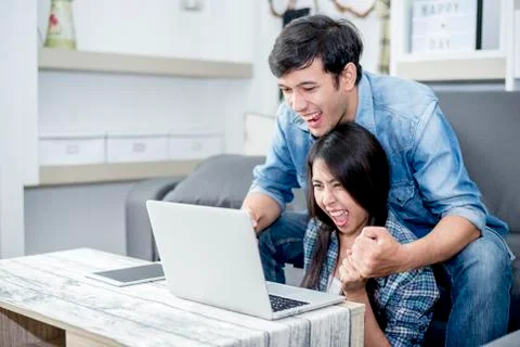 Lover are surprising when using the laptop. Family concept, Lovers concept, T Fotos Stock