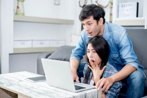 Lover are surprising when using the laptop. Family concept, Lovers concept, T Photos