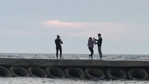 Lover having fun with sea waves Video stock 146414575