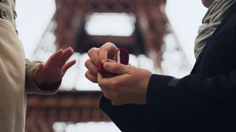 Lover making marriage proposal to his beloved girl on background of Eiffel Tower Stock Footage 83905629