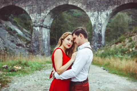 Lovers are standing by the bridge Stock Photos