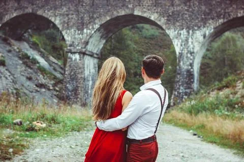 Lovers are standing by the bridge Stockfoto's