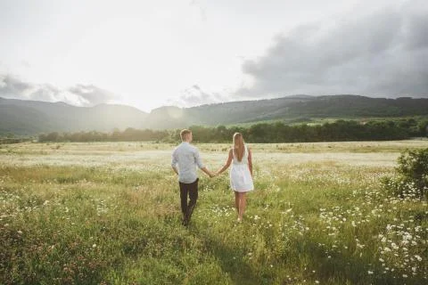  lovers in a chamomile field Stock Photos