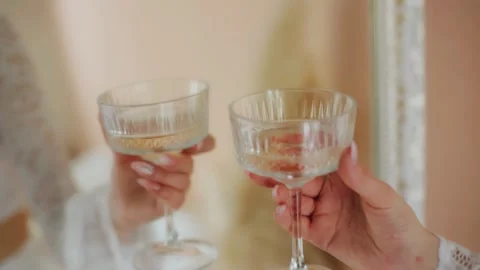 Lovers clink glasses of wine in bed in the bedroom. Close-up shooting Stock Footage 315791444