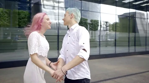 Lovers couple hipsters in white shirts. they are happy together. enjoy a joint Stock Footage
