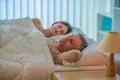 The lovers couple sleeping on the bed Photo