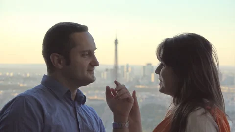 Lovers couple talking, Paris Eiffel tower in background Video stock 263982226