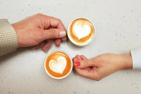 Lovers with cups of coffee Foto stock
