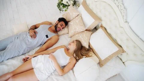 Lovers Fall Into Bed Forgetting About Everything in Bright Cozy Фото