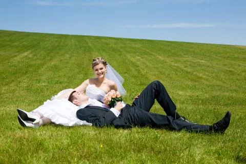 Lovers on the green grass Stock Photos