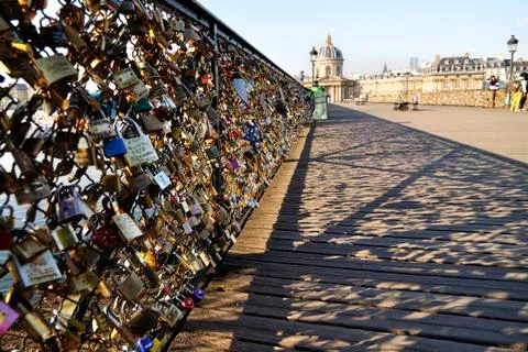 Lovers have locked thousands of locks to the Pont des Arts bridge in Paris. T Stock Photos