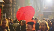 The Lovers With Heart-Like Umbrella Above The People Crowd, Slow Motion Stock Footage