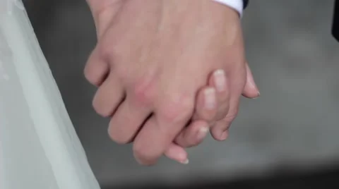 Lovers hold each other's hands Stock Footage 63320941