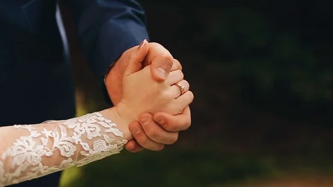 Lovers hold hands. Beautiful close-up of their palms. It's very beautiful. Stock Footage 110855071