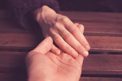 Lover's holding hands Stock Photos