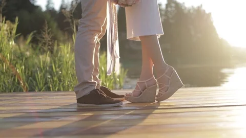 Lovers hugging on the pier in the summer evening Stock Footage 96153087