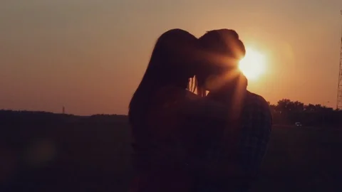 Lovers hugging at sunset Stock Footage 107670467