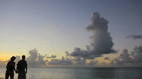 Lovers at the island beach in sunset Stock Footage 8927279