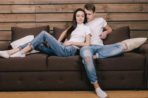 Lovers lie in bed at home Stock Photos
