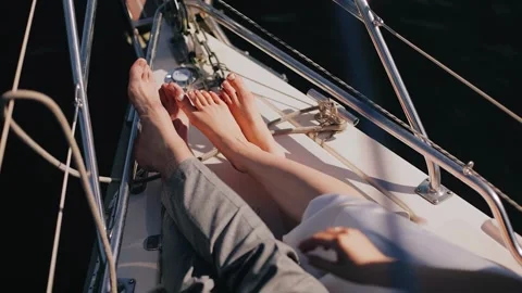 Lovers lie on the bow of the yacht while moving Stock Footage 270757314