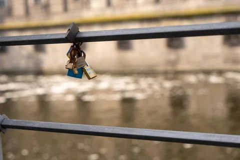 Lovers' locks locked on a bridge. Stock Photos