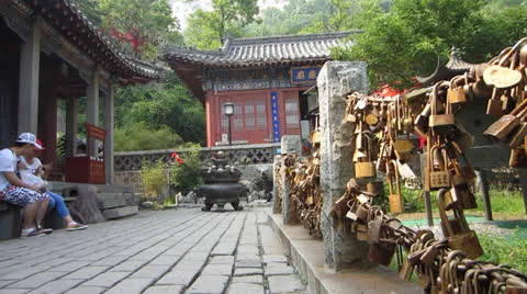 Lovers locks next to mountain temple Stock Footage 24728372