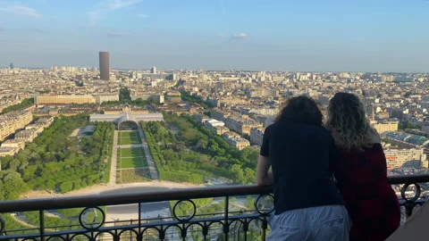 Lovers looking at the Champs de Mars park from the Eiffel Tower in Paris, France Stock Footage 194427352