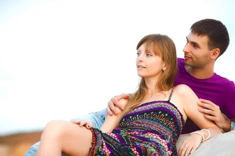 Lovers lying on the beach Stock Photos