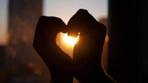 Lovers make a heart out of their hands and cross their fingers in the castle Stock Footage 74369448