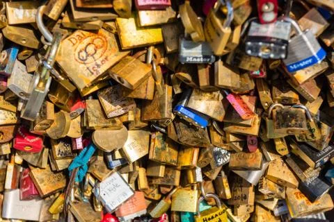 Lovers padlocks on a bridge in Paris Stock Photos