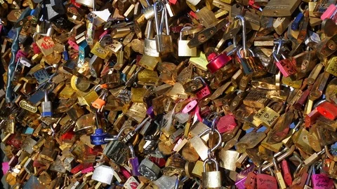 Lover's padlocks or love locks which adorn many bridges in Paris, France Stock Footage 106642599