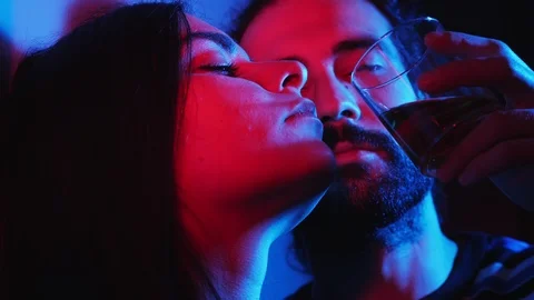 Lovers playing and flirting  drinking alcohol in a night club.Sensuality,night Stock Footage 103510175