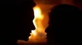 The lovers silhouette close up portrait view by the fireplace background 4k or 4k+ Resolution