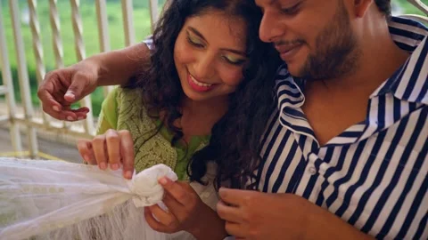 Lovers sit closely sharing warm affection atop terrace Stock-Footage 310290920