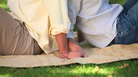Lovers sitting on the grass in the park Stock-Footage 2923141