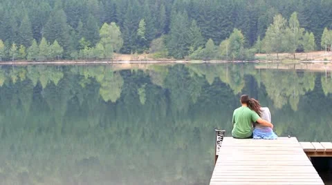 Lovers sitting on the pontoon Stock Footage 12301605