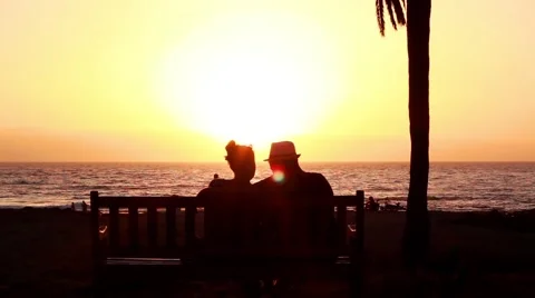 Lovers at sunset on the beach Stock Footage 40933836