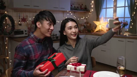 Lovers taking self photo with present box Video stock 165756473