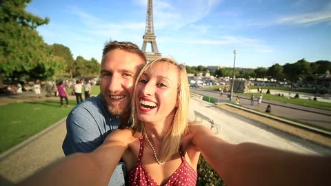 Lovers taking selfie at the Eiffel tower, Paris Stock Footage 75996073