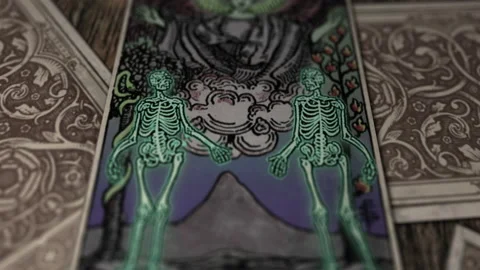 The Lovers tarot card two spooky romantic skeletons standing below the angel Stock Footage 164890784
