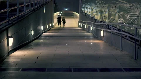 Lovers under the empty underpass at night Stock Footage 146177390