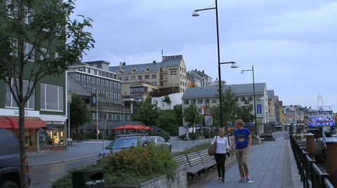 Lovers walk boardwalk at dusk Stock Footage 27520404